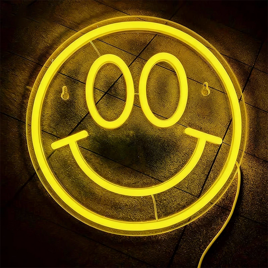 Neon smile face sign on a dark background