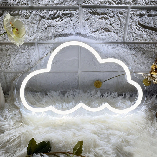 White cloud-shaped neon light on a textured surface with a flower and green leaves.