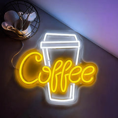 Neon sign with 'Coffee' text and cup design held by a person.