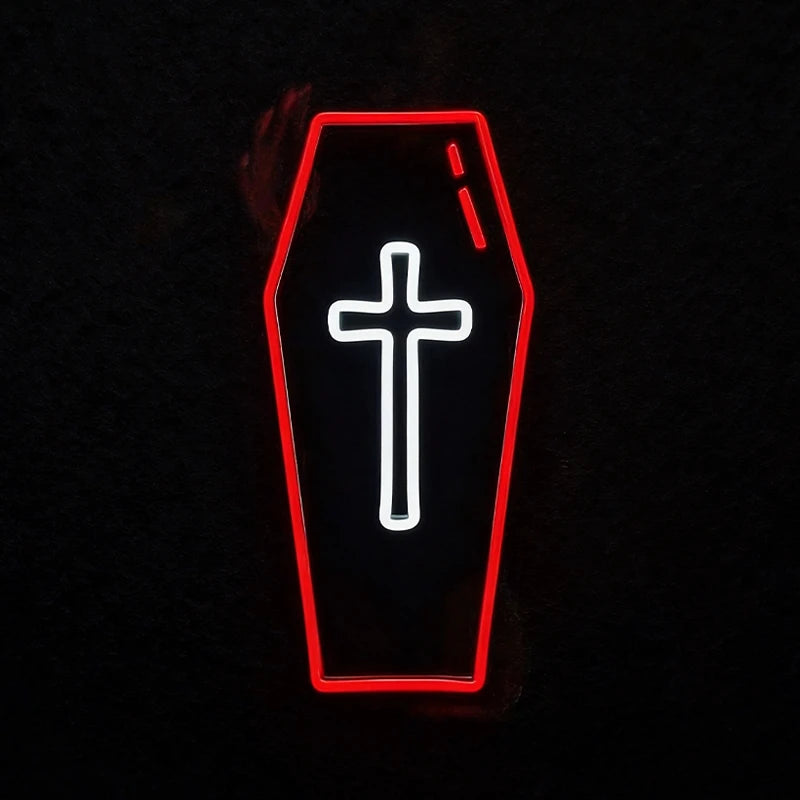 A coffin-shaped black sign with a glowing red outline and a white cross in the center, set against a dark background.