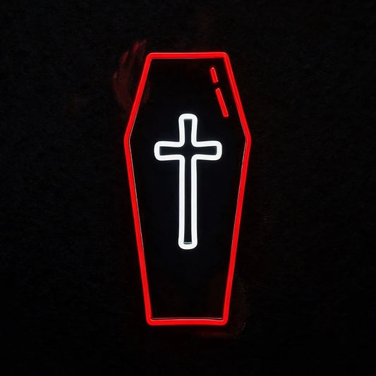 A coffin-shaped black sign with a glowing red outline and a white cross in the center, set against a dark background.