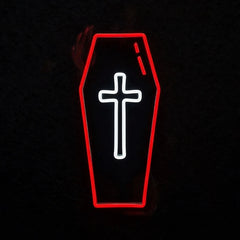 A coffin-shaped black sign with a glowing red outline and a white cross in the center, set against a dark background.