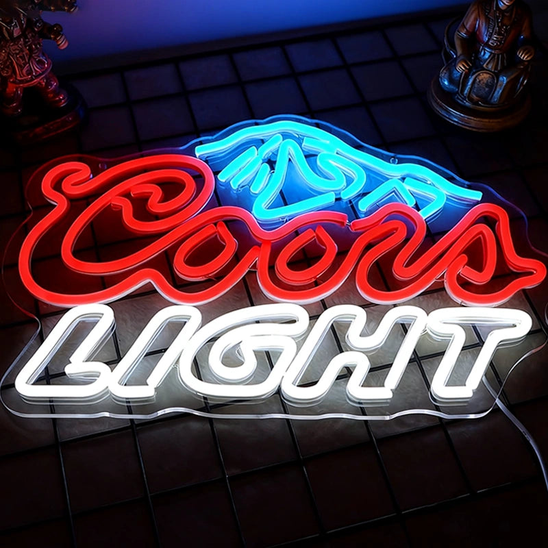 Neon Coors Light sign on a dark tiled wall