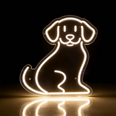 Neon light shaped like a dog on a reflective surface with a dark background