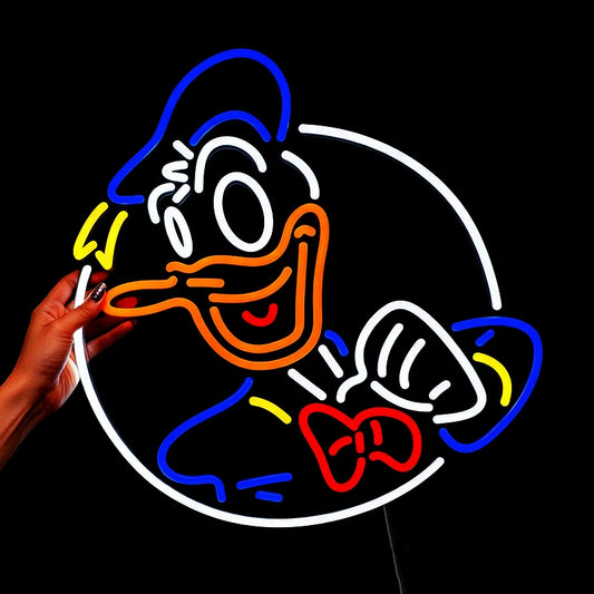Person holding a donald duck neon light with mixed colors in a dark background