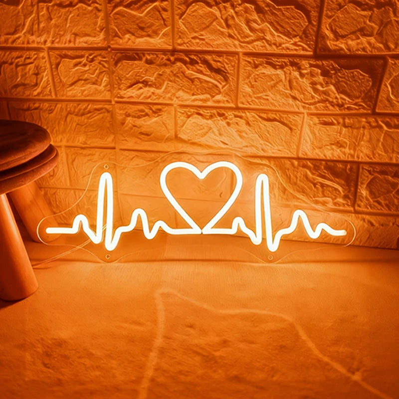 Neon with warm white light shaped like a heart with a heartbeat line on a textured wall.