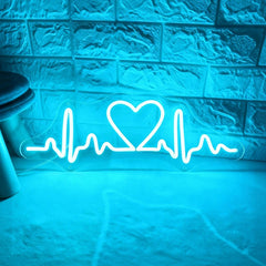 Neon with ice blue light shaped like a heart with an ECG line on a textured wall.