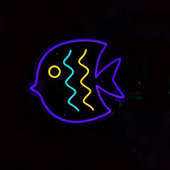 Neon sign of a fish shape on a black background