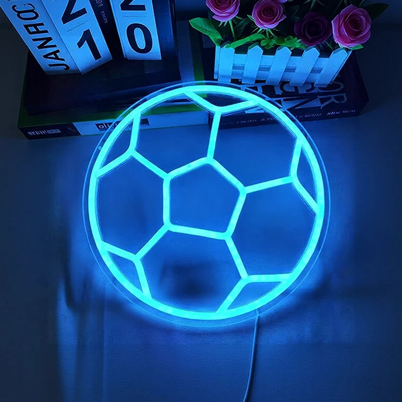 Neon light shaped like a soccer ball on a dark background
