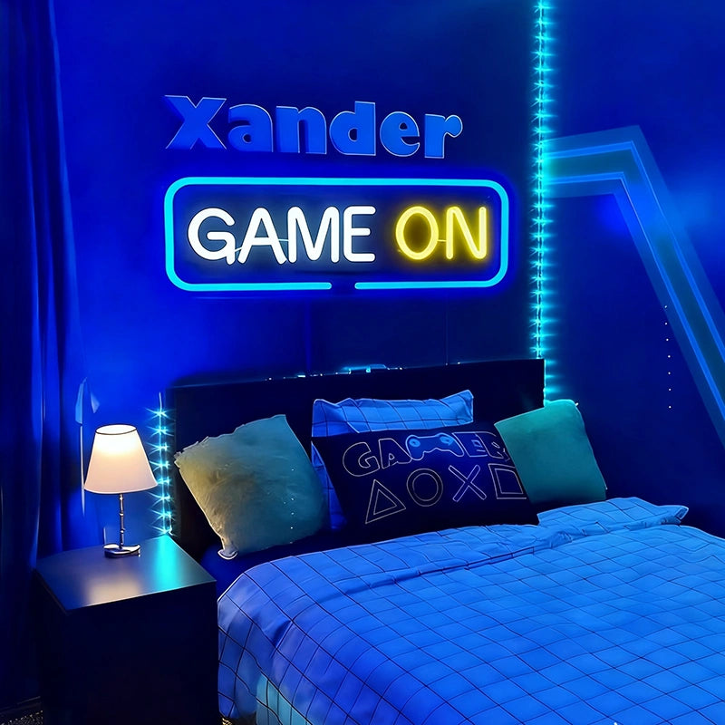 A vibrant bedroom with a gaming theme, featuring a neon sign on the wall that reads 'GAME ON' in blue, white, and lemon yellow lights above a bed.