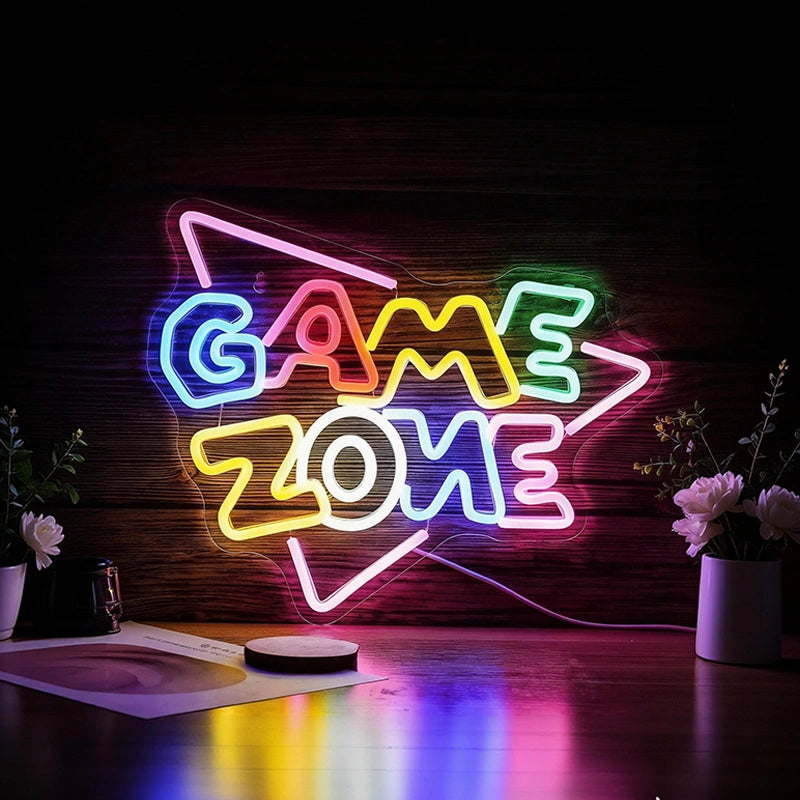 Neon sign that reads 'GAME ZONE' on a dark background