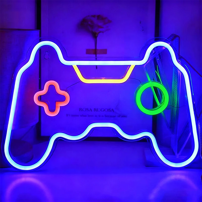 Neon light shaped like a gaming controller on a dark background.