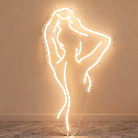 Neon warm white light sculpture of a glowing nude lady on a wall.
