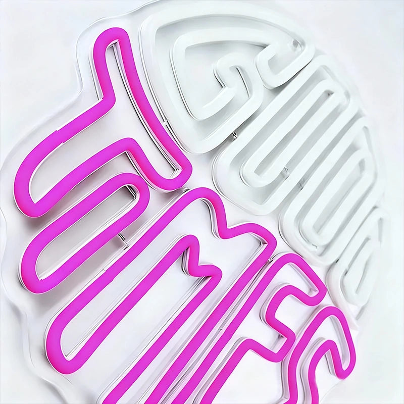 Cookie cutters with pink and white designs on a white background