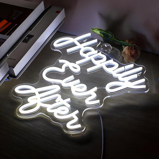 Neon sign with 'Happy Ever After' on a dark surface