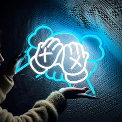 Neon sign of kaws on a textured dark background