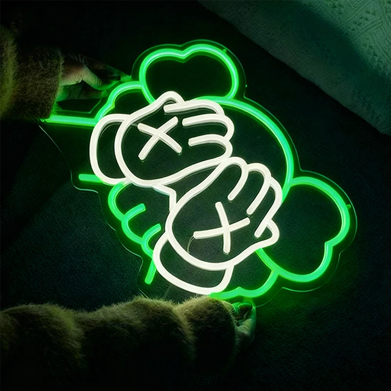 Neon sign of kaws design on a dark background