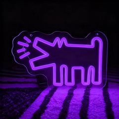 Purple neon sign shaped like a barking dog on a dark background