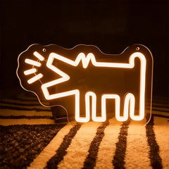 Warm white neon sign shaped like a barking dog on a dark background