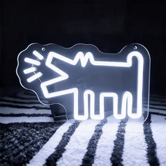 White neon sign shaped like a barking dog on a dark background