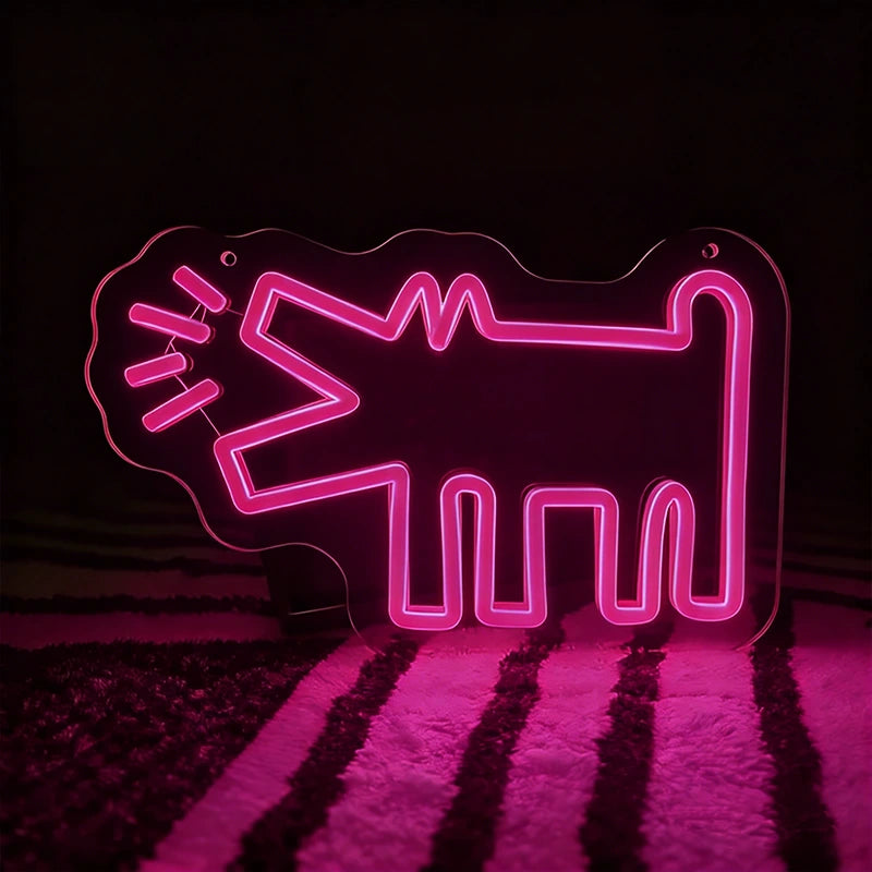 Hot pink neon sign shaped like a barking dog on a dark background