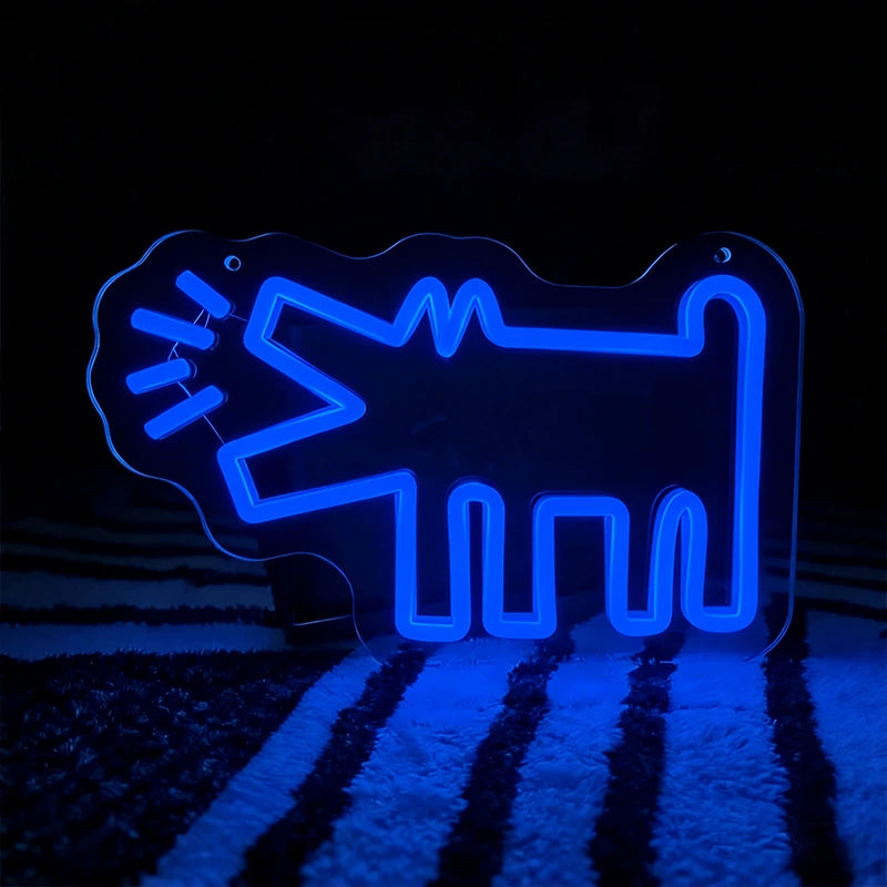 Blue neon sign shaped like a barking dog on a dark background
