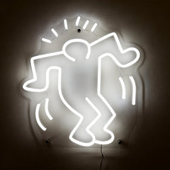 Neon white light shaped like a stylized figure on a dark background