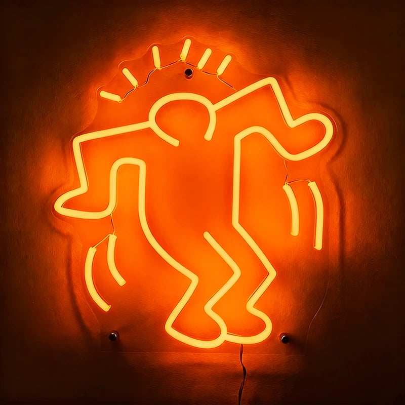 Neon sign of a stylized figure on an orange background