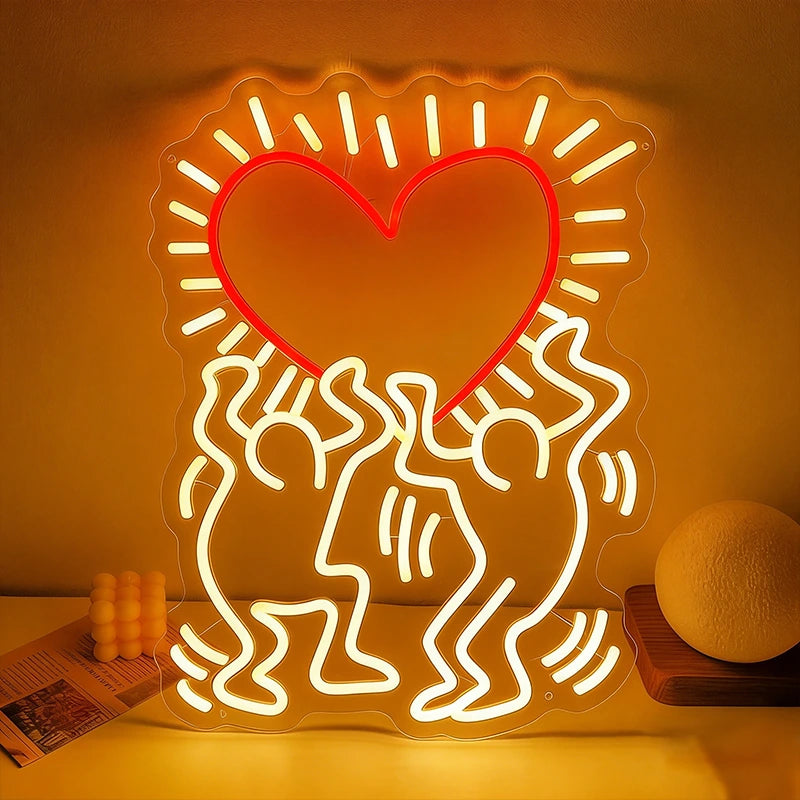 Neon light sculpture of people holding a heart on a warm-toned background