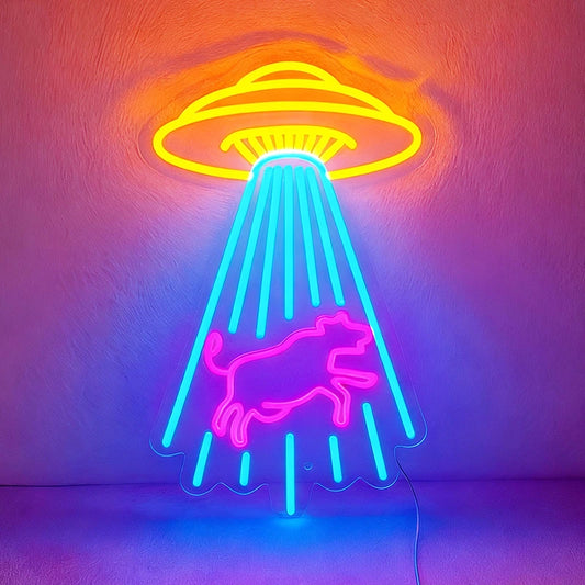 Neon sign with a UFO and cow design on a textured wall.