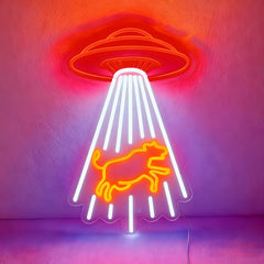 Neon sign with a red UFO and orange cow design on a pink background