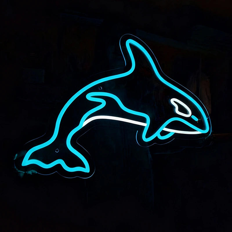 Neon sign with ice blue color of a shark shape on a black background