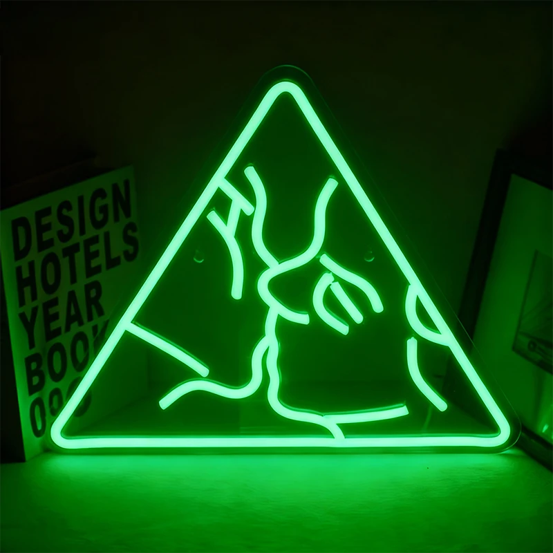 Neon green triangle-shaped sign with abstract design on a dark background