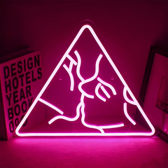 Neon hot pink sign of a couple kissing in a triangle on a dark background