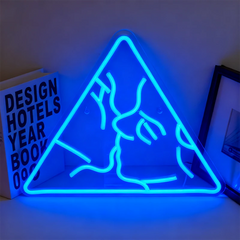 Neon blue triangle-shaped light with a kiss design on a white surface.