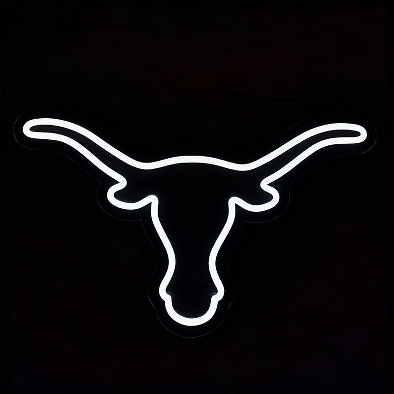 Neon sign of a longhorn logo on a black background