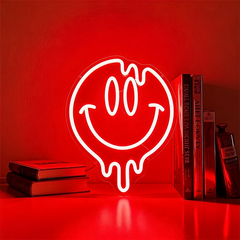 Neon light shaped like a smiley face with a red background
