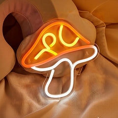 Neon sign shaped like mushroom on a brown fabric background