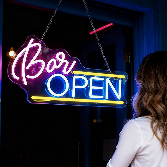 Woman standing in front of a bar with a neon 'Bar Open' sign