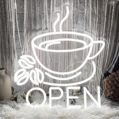 Neon sign of a coffee cup with beans and 'OPEN' text on a textured background