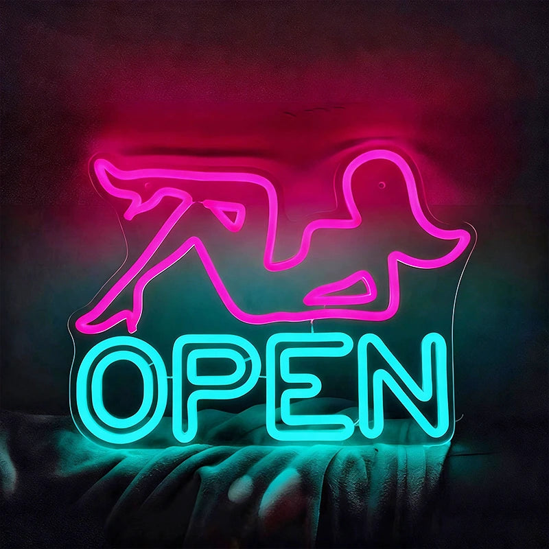 Neon sign with pink woman outline and ice blue 'OPEN' text on a dark background