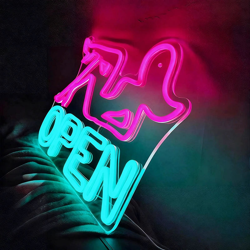 Neon sign with pink and green colors on a dark background