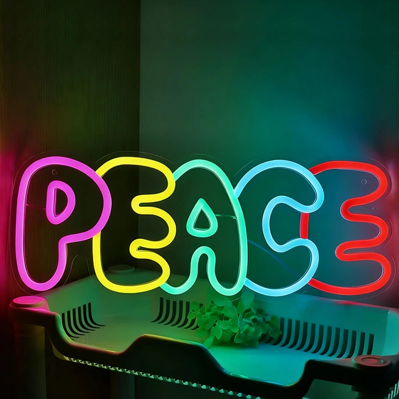 Neon sign with the word 'PEACE' in colorful letters on a dark background