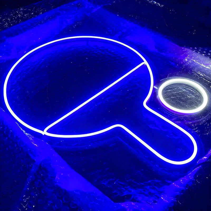 Neon sign of a blue ping pong paddle on a dark background
