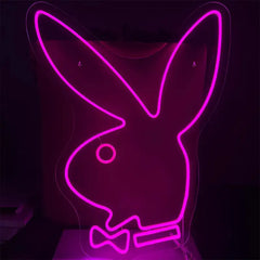 Neon pink outline of a rabbit with a bow tie on a black background