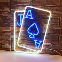 Neon sign with 'Jack of Aces' design on a brick wall background