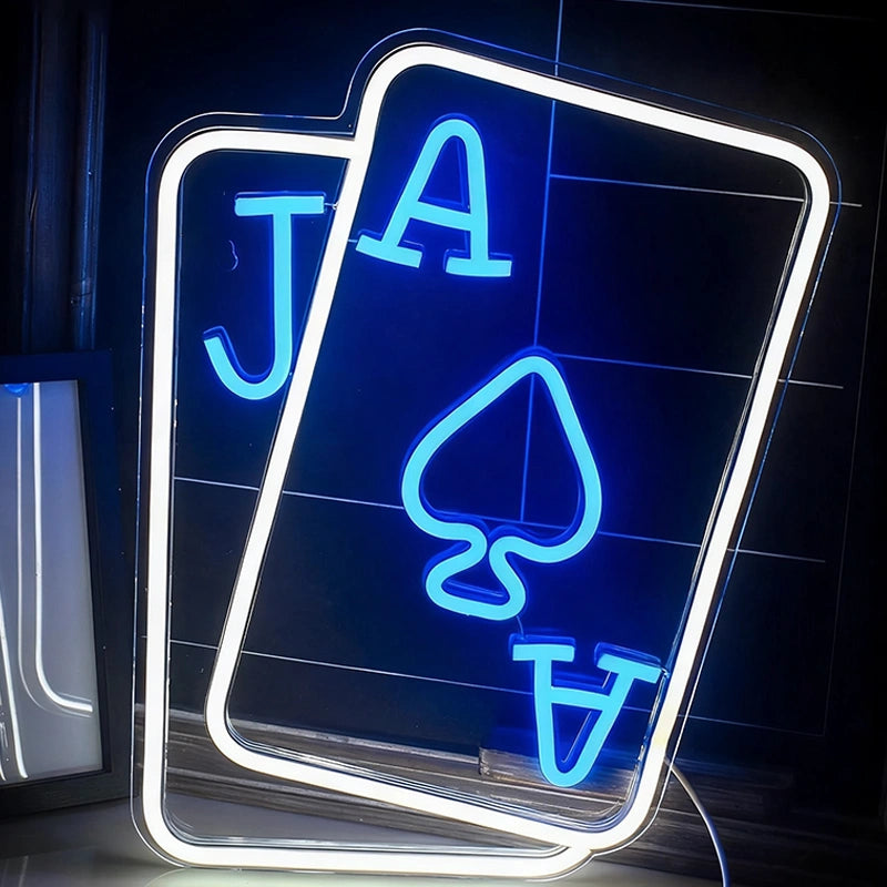 Neon sign of playing cards on a dark background