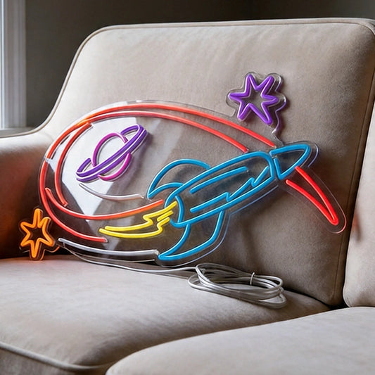 Colorful rocket ship neon sign on a beige couch