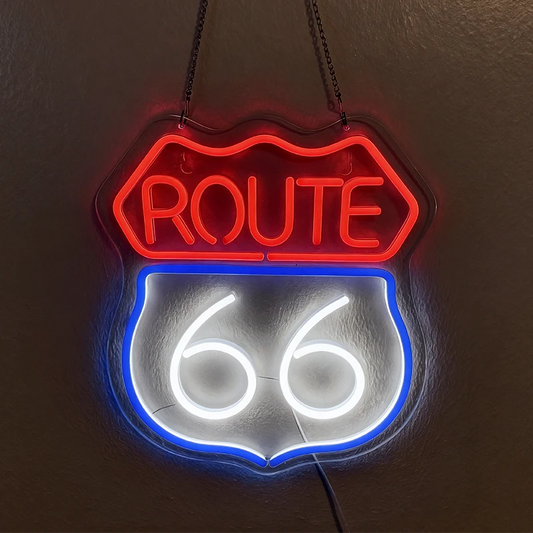 Neon sign with 'ROUTE 66' on a dark background
