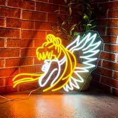 Neon sign of cartoon character sailor moon against a brick wall.
